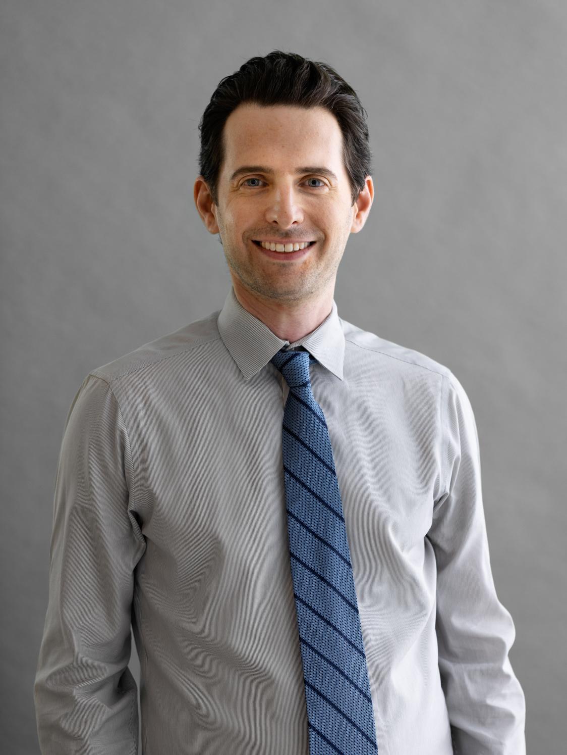 Headshot photo of Adam J. Blander